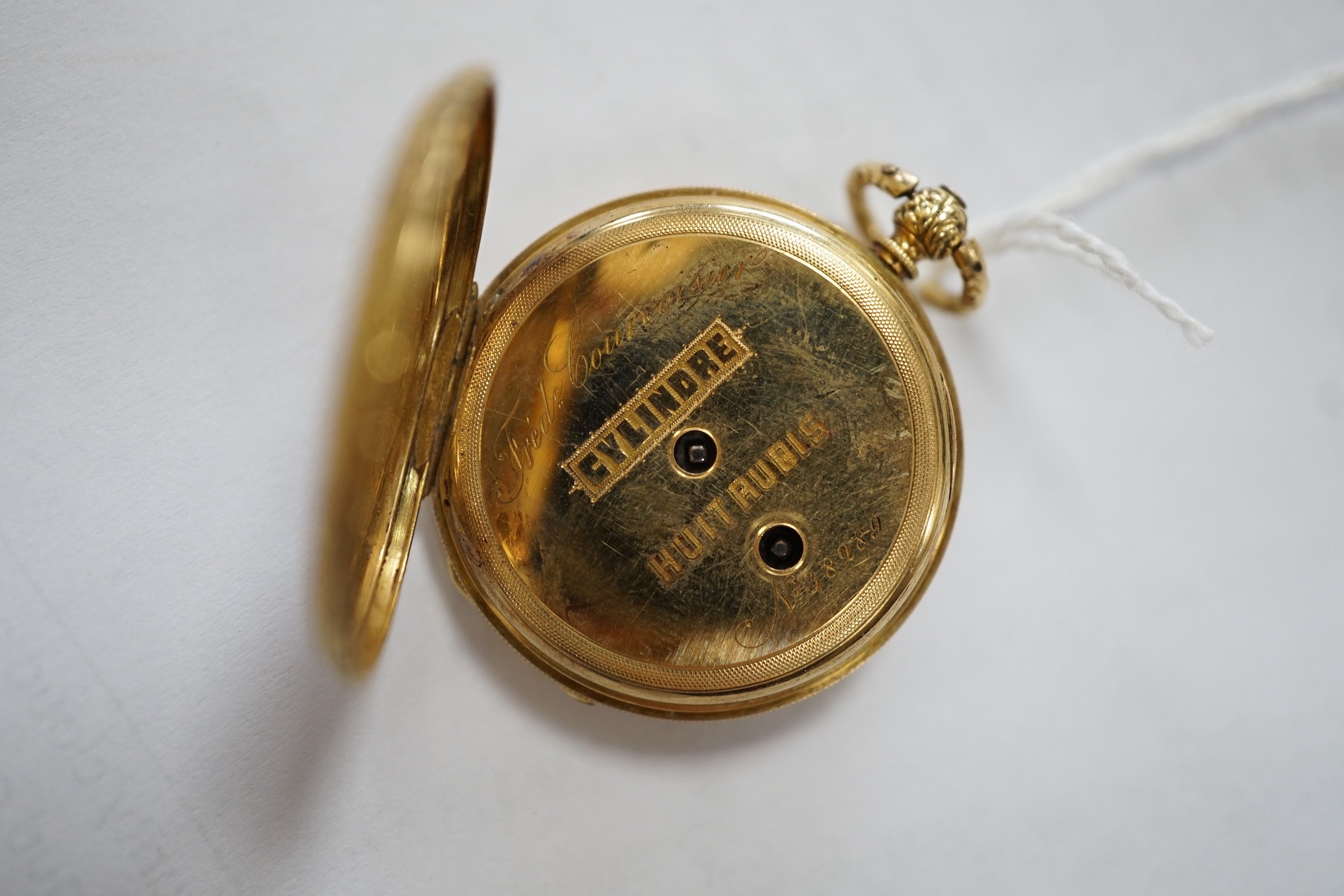 An early 20th century Swiss 18k and enamelled fob watch, decorated with the bust of a young girl and flowers verso, case diameter 33mm, gross weight 27.3 grams.